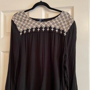 Black long sleeve top.